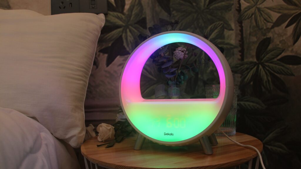 a colourful light-up mirror sitting on top of a wooden table
